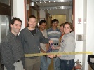 The official ribbon-cutting (more like "ribbon-gnawing") ceremony for the opening of additional lab space 137/139 RAL, January 2004